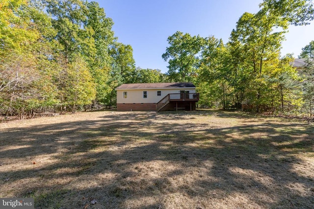 view of yard with a wooden deck