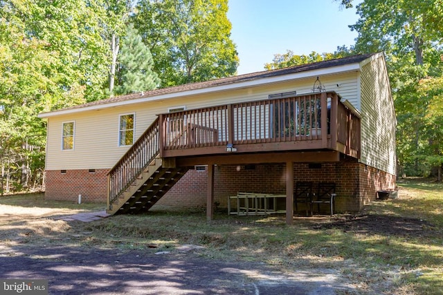 rear view of house featuring a deck