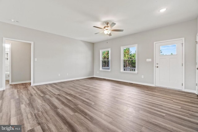 371 Glenmore Ln, Keswick, VA 22947 - unfurnished living room with a ceiling fan, baseboards, wood finished floors, and recessed lighting