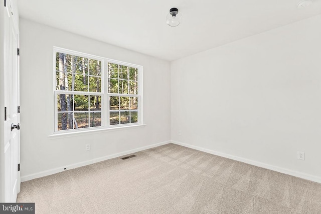 unfurnished room with carpet