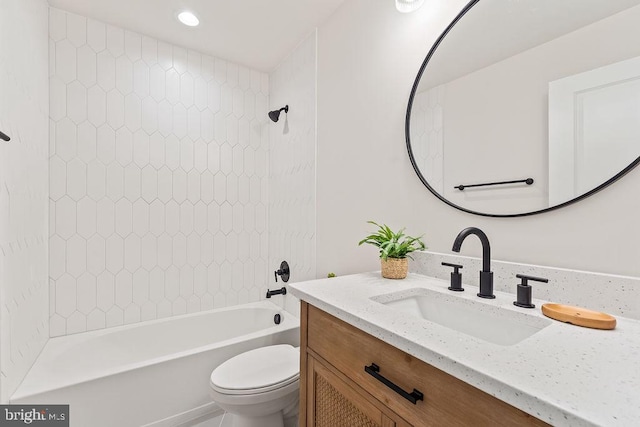 full bathroom with toilet, tiled shower / bath combo, and vanity