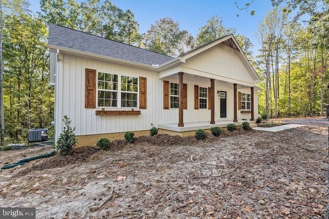 view of front of house featuring a porch and central air condition unit