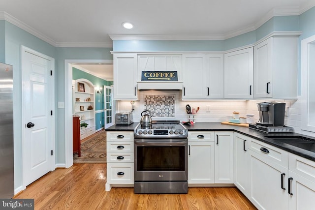 kitchen with white cabinetry, stainless steel appliances, and light wood-type flooring