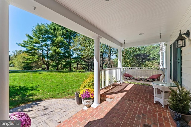 view of patio featuring a porch