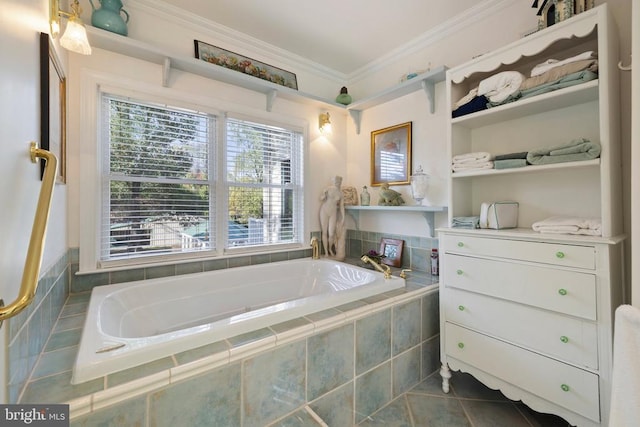 bathroom with vanity, tile patterned floors, crown molding, and tiled tub