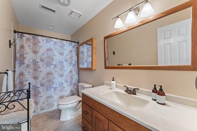 full bathroom featuring toilet, shower / bath combo, vanity, and tile patterned floors