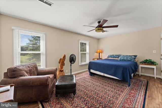 bedroom featuring hardwood / wood-style floors and ceiling fan