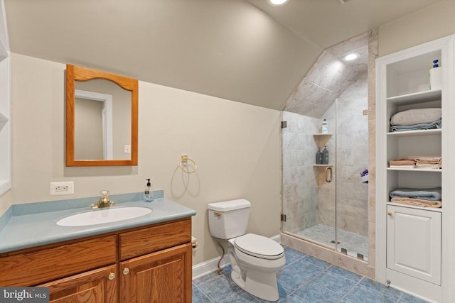 bathroom with vanity, a shower with shower door, toilet, and tile patterned floors