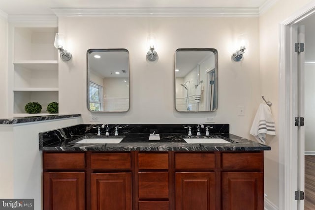 bathroom featuring vanity, crown molding, and hardwood / wood-style floors