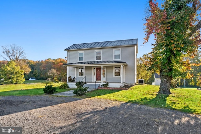 view of front of property with a front lawn and covered porch