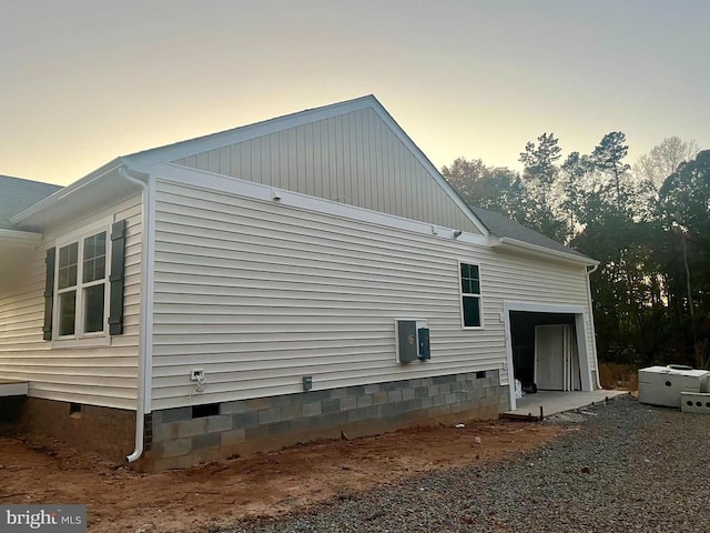 view of property exterior at dusk