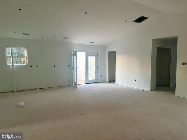 spare room featuring vaulted ceiling