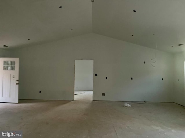 spare room featuring lofted ceiling