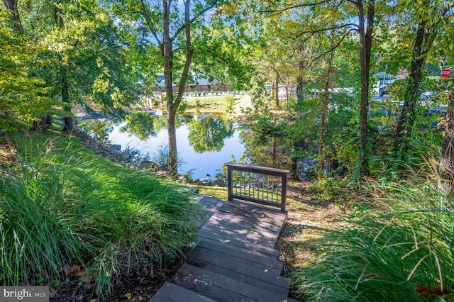 surrounding community featuring a water view