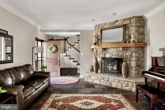 living room featuring crown molding and a fireplace