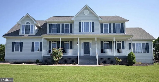 colonial house with covered porch and a front yard