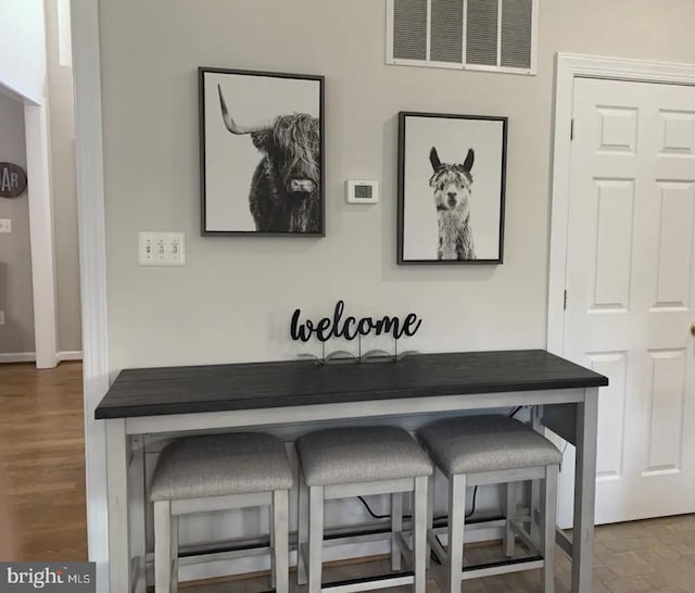 details featuring hardwood / wood-style flooring