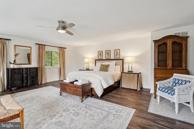 bedroom featuring dark hardwood / wood-style flooring and ceiling fan