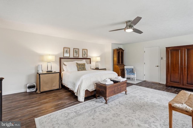 bedroom featuring dark hardwood / wood-style flooring and ceiling fan