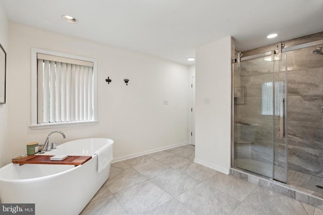 bathroom with shower with separate bathtub