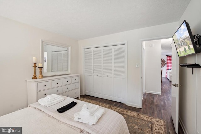 bedroom featuring a closet and dark wood-type flooring