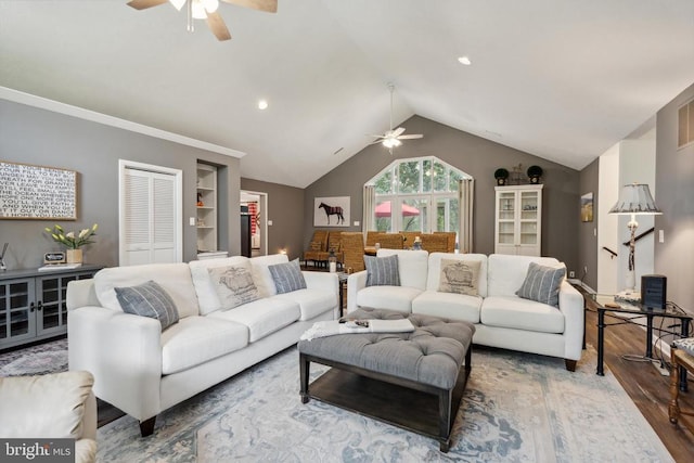 living room featuring ceiling fan, vaulted ceiling, and hardwood / wood-style floors