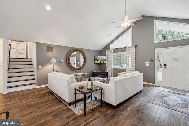 living room with dark hardwood / wood-style floors, a healthy amount of sunlight, high vaulted ceiling, and ceiling fan