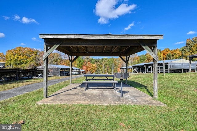 surrounding community with a yard and a gazebo