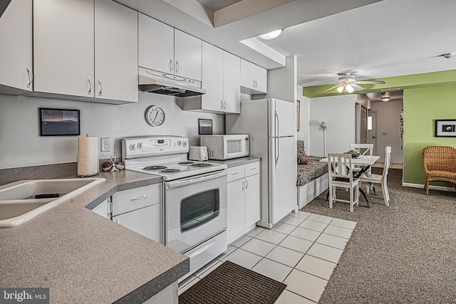 kitchen featuring white cabinets, ceiling fan, light tile patterned floors, sink, and white appliances