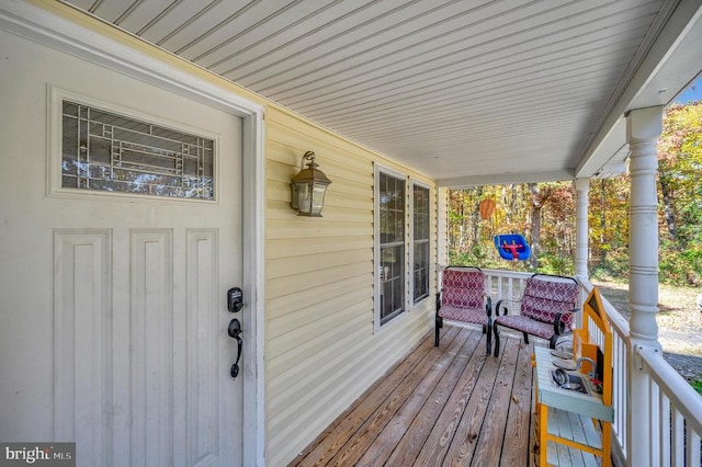 wooden terrace featuring a porch