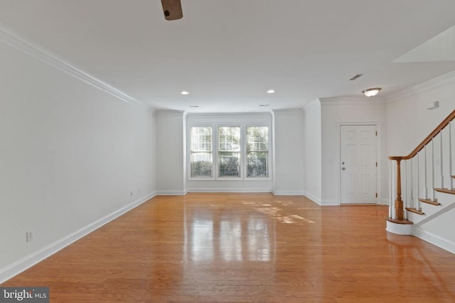 unfurnished living room featuring light hardwood / wood-style floors and ornamental molding