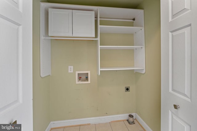 clothes washing area featuring hookup for an electric dryer, hookup for a washing machine, cabinets, and light tile patterned flooring