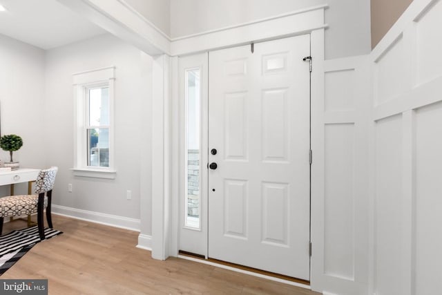 foyer entrance with light hardwood / wood-style flooring