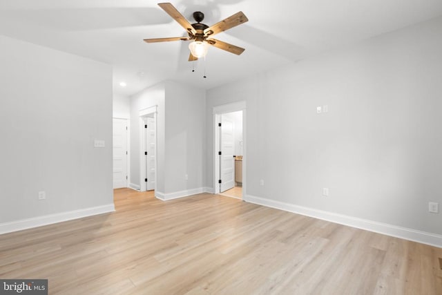 empty room featuring ceiling fan and light hardwood / wood-style flooring