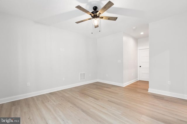 unfurnished room with ceiling fan and light hardwood / wood-style floors