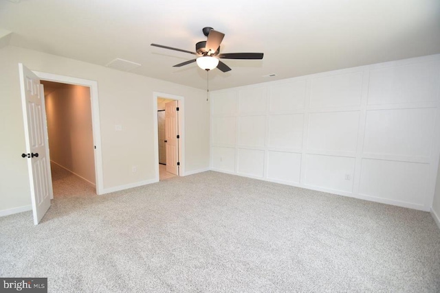 unfurnished bedroom featuring light carpet and ceiling fan