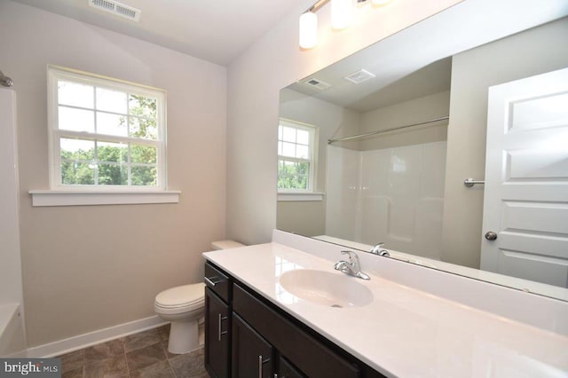 full bathroom with vanity, toilet, and washtub / shower combination