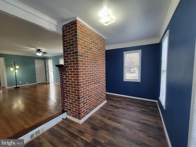 unfurnished living room featuring dark hardwood / wood-style floors, crown molding, and ceiling fan