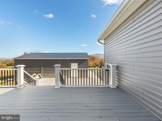 wooden deck with a mountain view