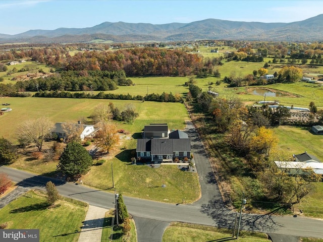 birds eye view of property featuring a mountain view