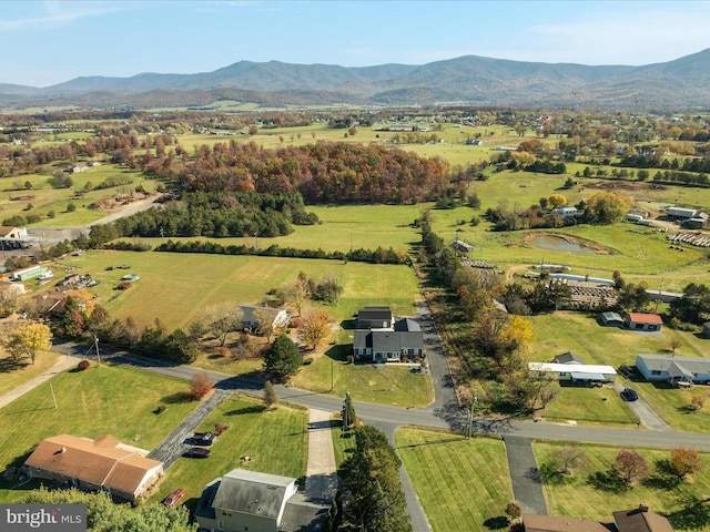 birds eye view of property featuring a rural view and a mountain view