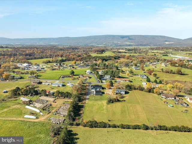 birds eye view of property with a mountain view and a rural view