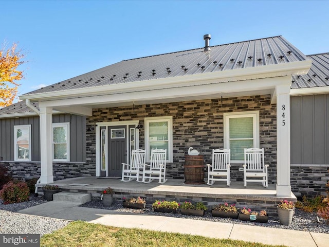 doorway to property with a porch