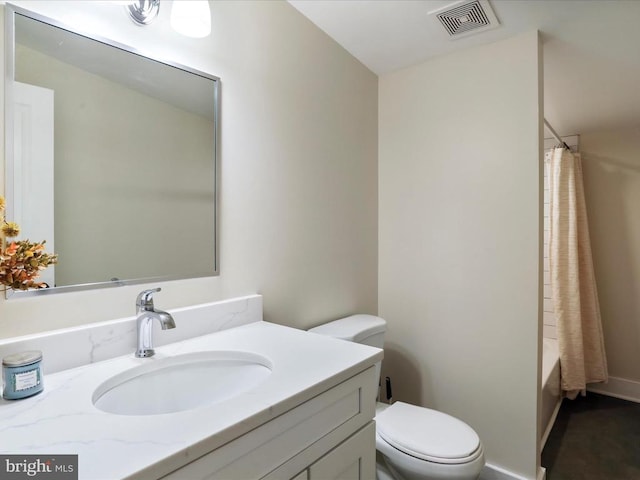 full bathroom with vanity, toilet, and shower / tub combo with curtain