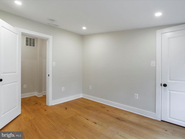 empty room with light hardwood / wood-style floors