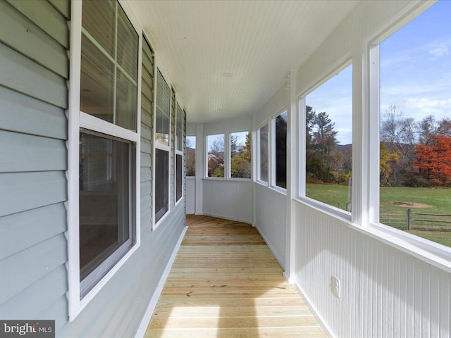 unfurnished sunroom featuring a healthy amount of sunlight