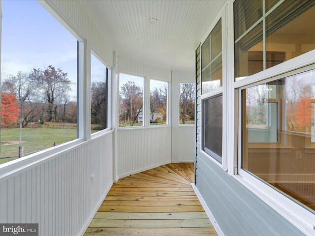 unfurnished sunroom with plenty of natural light