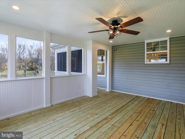 wooden terrace featuring ceiling fan