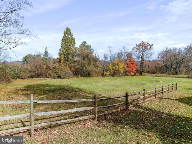 view of yard with a rural view