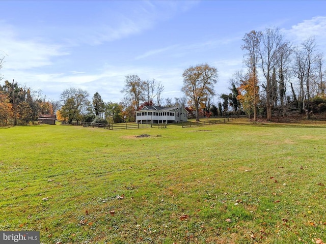 view of yard with a rural view